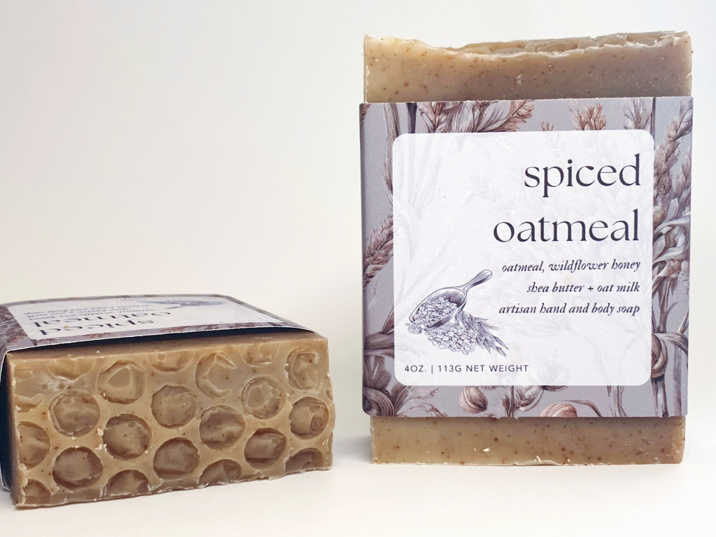 two spiced oatmeal soaps against a white backdrop