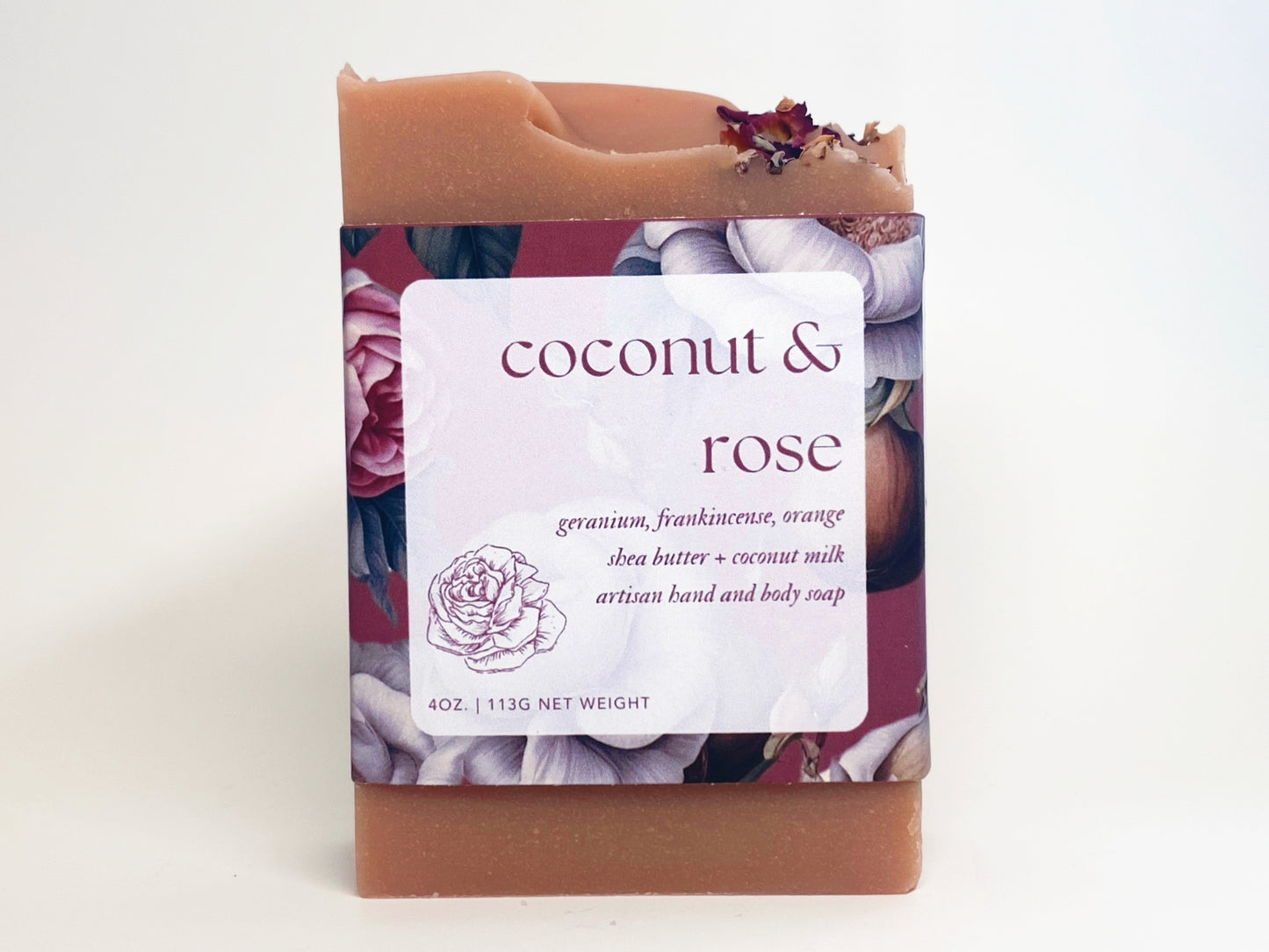 bar of coconut and rose soap against a white backdrop
