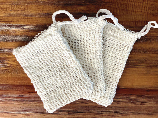 three agave fiber drawstring bags laying on a wooden table